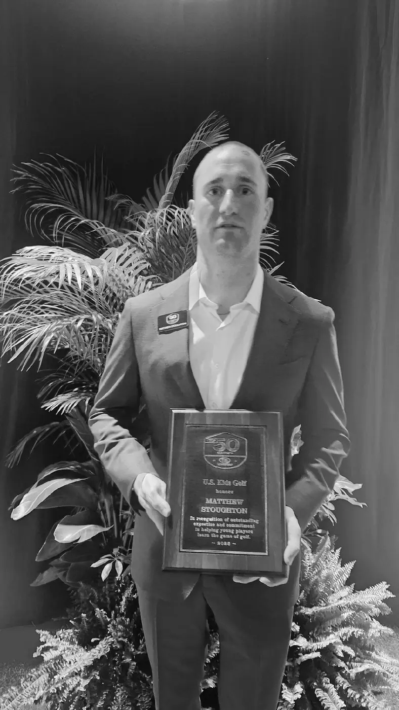 Matt Stoughton holding his U.S. Kids Golf Top 50 award